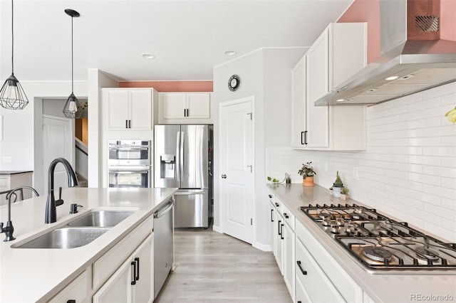 4280 Pioneer Pl, Brighton, CO 80601 - kitchen featuring wall chimney exhaust hood, appliances with stainless steel finishes, a sink, tasteful backsplash, and white cabinetry