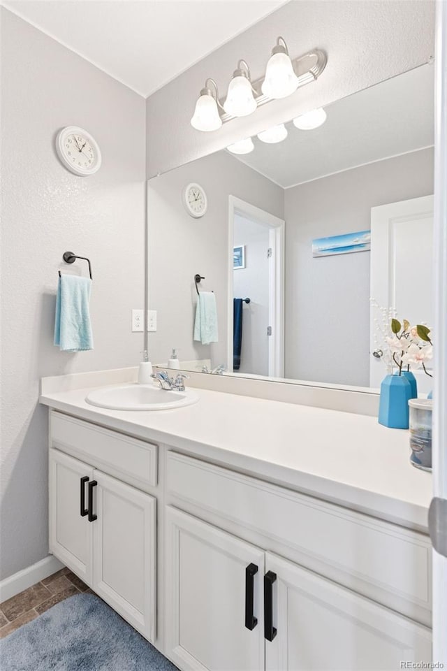 4280 Pioneer Pl, Brighton, CO 80601 - bathroom with vanity and baseboards