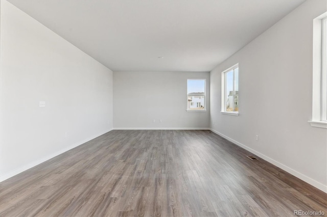 empty room featuring hardwood / wood-style floors