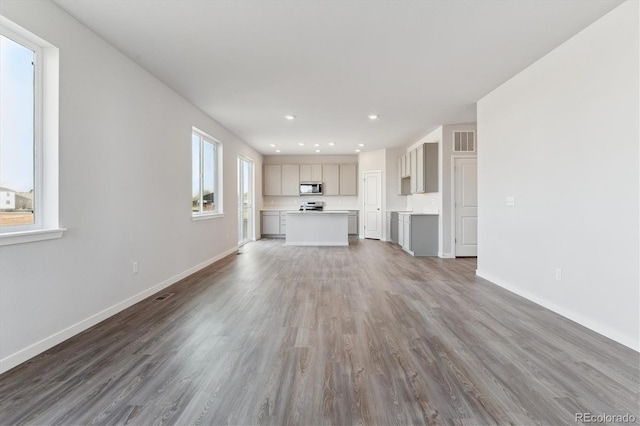 unfurnished living room with wood-type flooring