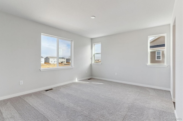 unfurnished room with carpet floors