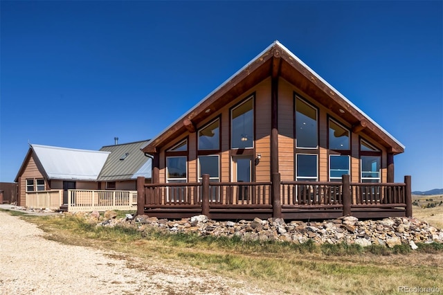 view of home's exterior featuring a wooden deck