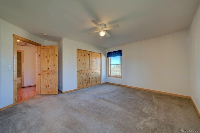 unfurnished bedroom featuring a closet, ceiling fan, and carpet floors