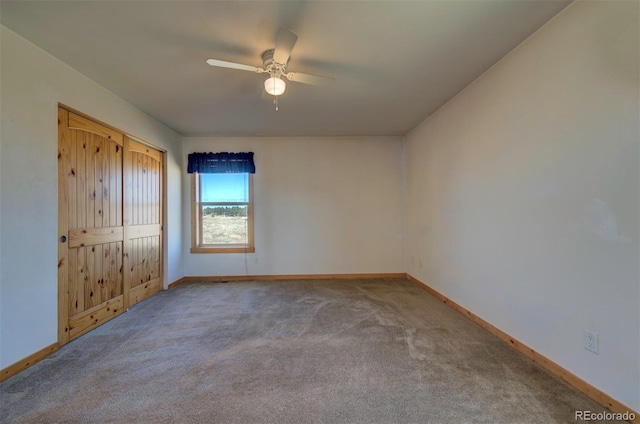 unfurnished bedroom with carpet flooring, ceiling fan, and a closet