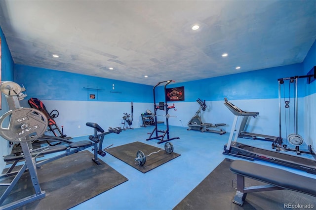 exercise room featuring concrete flooring