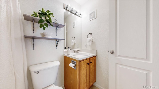 1670 S Deframe St Unit C2, Lakewood, CO 80228 - bathroom featuring toilet and vanity
