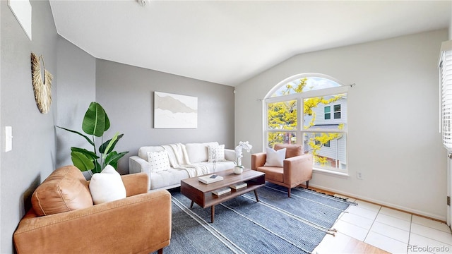 1670 S Deframe St Unit C2, Lakewood, CO 80228 - living area featuring vaulted ceiling and baseboards