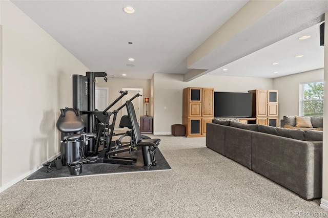 workout area featuring light colored carpet