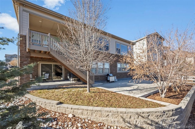 rear view of house featuring a patio area