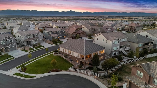 aerial view at dusk featuring a mountain view