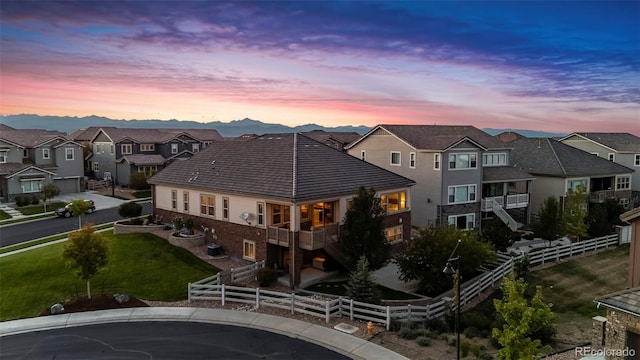 view of back house at dusk