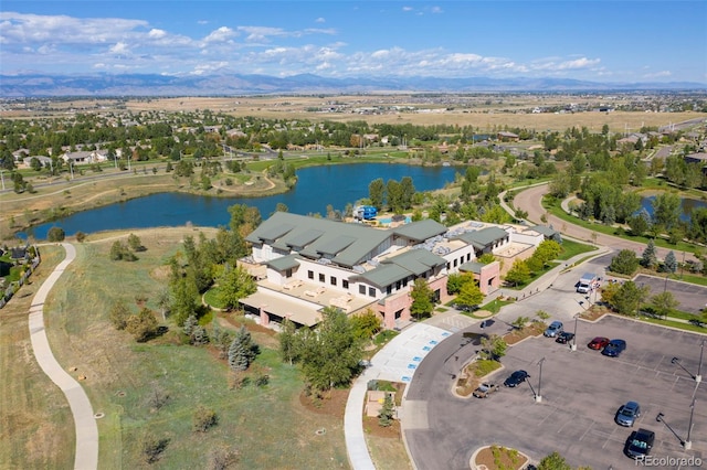 drone / aerial view with a water and mountain view