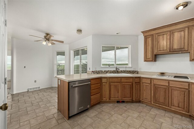 27190 Private Road 139, Agate, CO 80101 - kitchen featuring stainless steel dishwasher, black electric cooktop, light countertops, and brown cabinetry