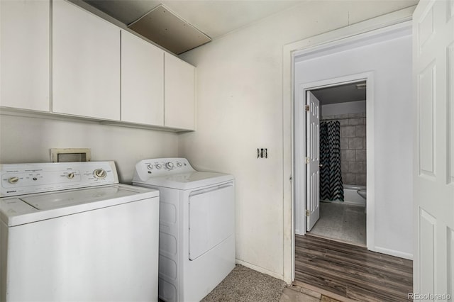 27190 Private Road 139, Agate, CO 80101 - washroom featuring cabinet space, washer and dryer, and wood finished floors