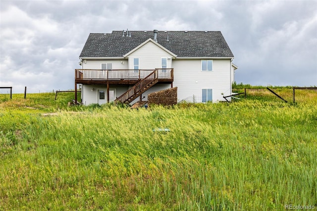 27190 Private Road 139, Agate, CO 80101 - rear view of house featuring a wooden deck, stairs, and a shingled roof