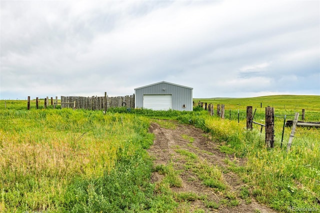 27190 Private Road 139, Agate, CO 80101 - view of yard with a garage, an outdoor structure, and a rural view