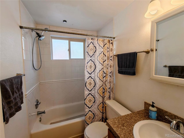 full bath with toilet, vanity, and shower / bath combination with curtain