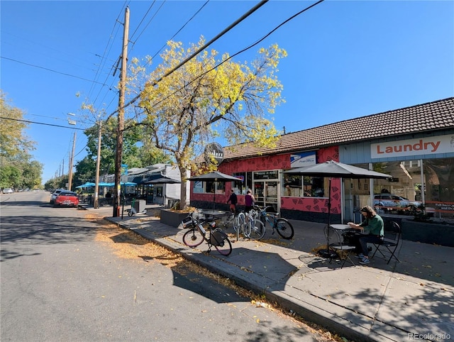 view of property with a tile roof