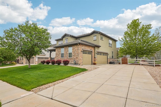 2605 Gray Wolf Loop, Broomfield, CO 80023 - view of front of house featuring stone siding, a garage, driveway, and stucco siding