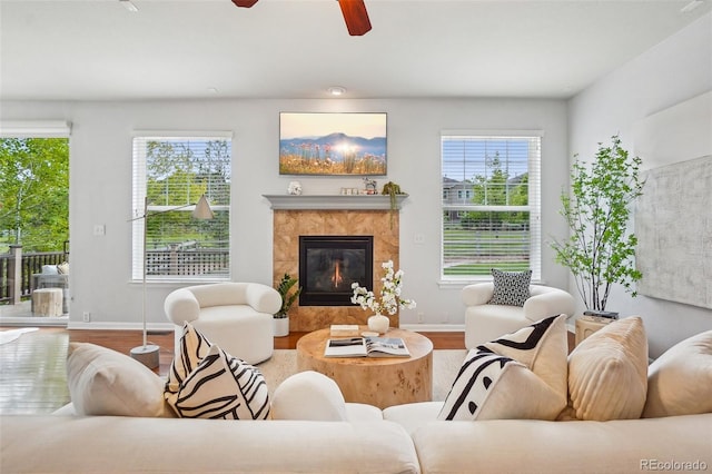 2605 Gray Wolf Loop, Broomfield, CO 80023 - living room with wood finished floors, healthy amount of natural light, and a ceiling fan