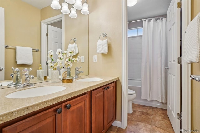 2605 Gray Wolf Loop, Broomfield, CO 80023 - bathroom featuring double vanity, toilet, shower / bath combo, a chandelier, and tile patterned floors