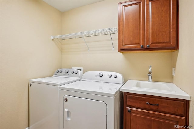 2605 Gray Wolf Loop, Broomfield, CO 80023 - laundry area featuring independent washer and dryer and cabinet space