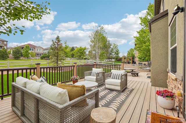 2605 Gray Wolf Loop, Broomfield, CO 80023 - wooden terrace featuring an outdoor living space with a fire pit and a yard