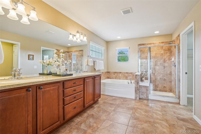 2605 Gray Wolf Loop, Broomfield, CO 80023 - full bathroom with a bath, double vanity, a shower stall, recessed lighting, and a chandelier