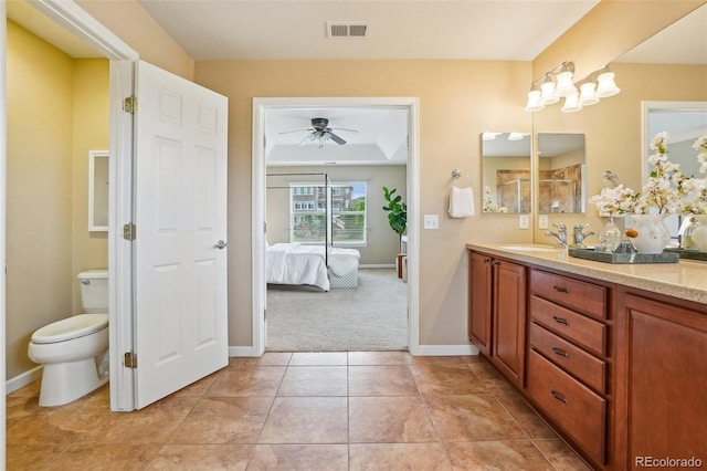 2605 Gray Wolf Loop, Broomfield, CO 80023 - full bathroom featuring vanity, ceiling fan, toilet, and baseboards