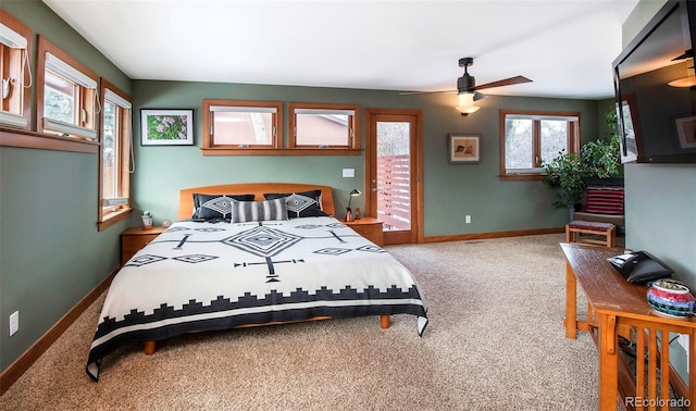 carpeted bedroom with access to exterior, baseboards, and a ceiling fan