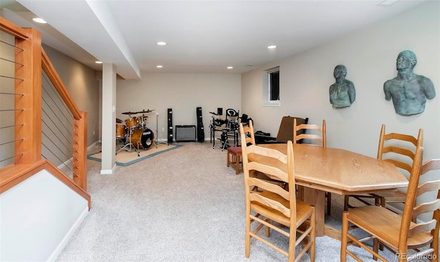 carpeted dining space with baseboards, stairway, and recessed lighting