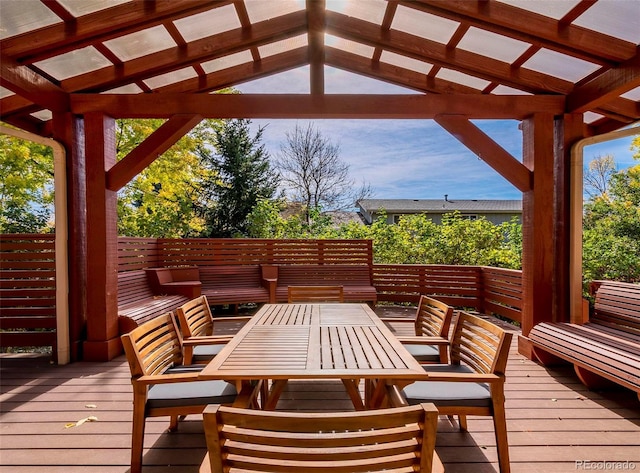 wooden deck featuring outdoor dining area