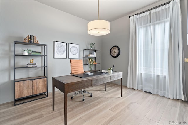 3147 S Quaker St, Morrison, CO 80465 - office area with light wood-style flooring and baseboards