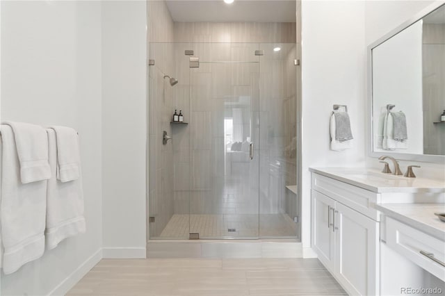 3147 S Quaker St, Morrison, CO 80465 - bathroom with vanity, a stall shower, tile patterned floors, and recessed lighting