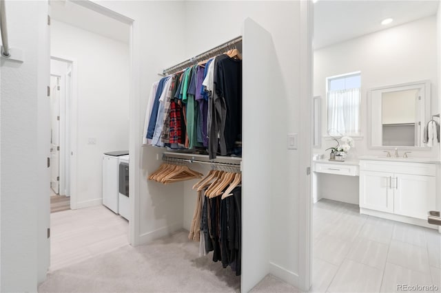 3147 S Quaker St, Morrison, CO 80465 - walk in closet with washer and clothes dryer and a sink