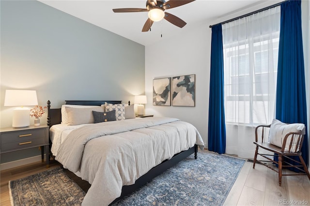 3147 S Quaker St, Morrison, CO 80465 - bedroom with light wood finished floors and a ceiling fan