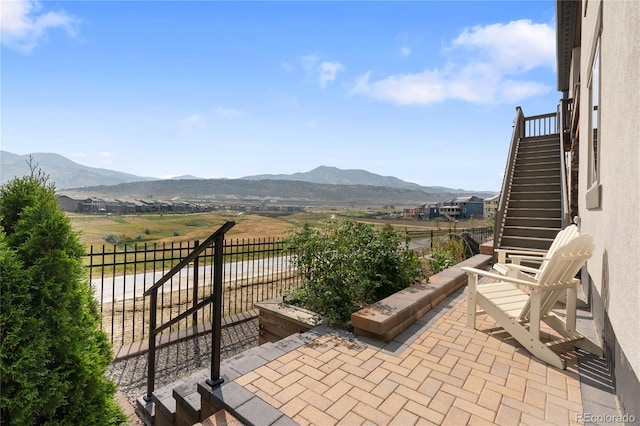 3147 S Quaker St, Morrison, CO 80465 - view of patio with stairway and a mountain view