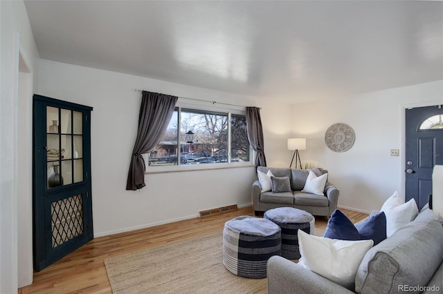 living room with light hardwood / wood-style floors