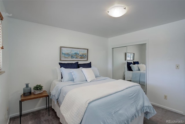 bedroom featuring a closet and dark colored carpet