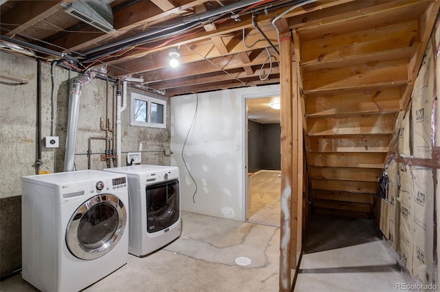 laundry area with washing machine and dryer