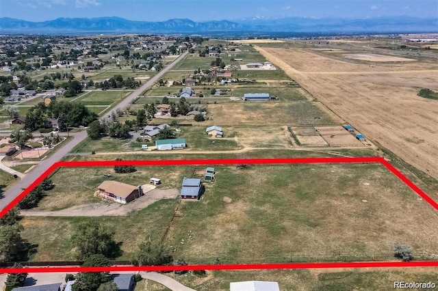 aerial overview of property's location featuring property boundaries highlighted and a mountainous background