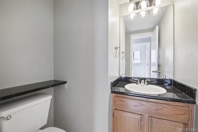 half bath with toilet and vanity