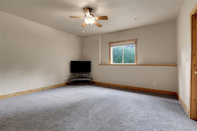 unfurnished living room featuring ceiling fan and carpet