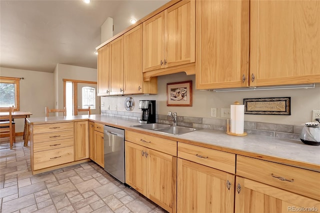 kitchen featuring kitchen peninsula, sink, stainless steel dishwasher, and light brown cabinets