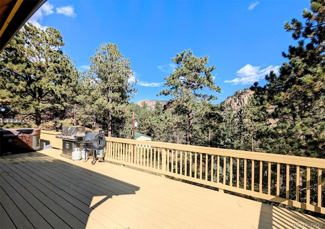 wooden terrace with grilling area