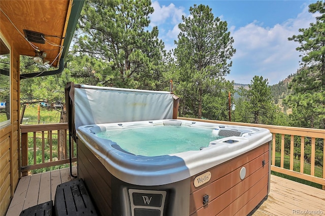 deck featuring a hot tub