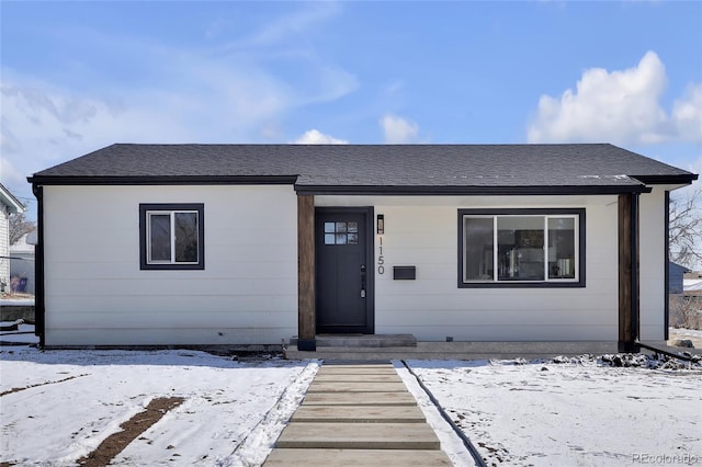 view of front of home with roof with shingles