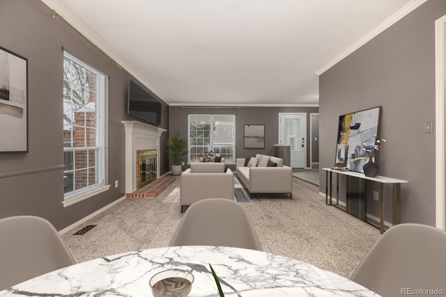 living area featuring a wealth of natural light, visible vents, carpet, and a glass covered fireplace