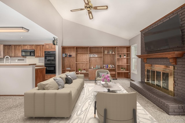 living area with light carpet, a brick fireplace, high vaulted ceiling, and ceiling fan