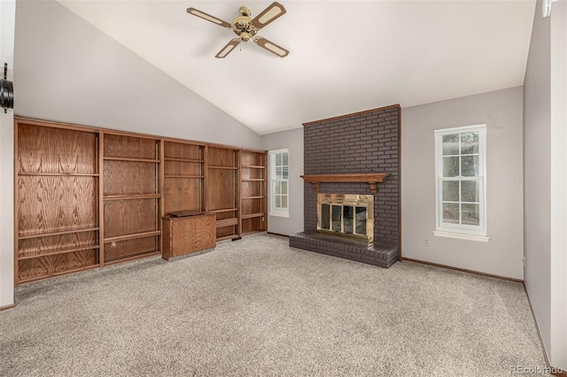 unfurnished living room with carpet flooring, baseboards, a brick fireplace, ceiling fan, and vaulted ceiling